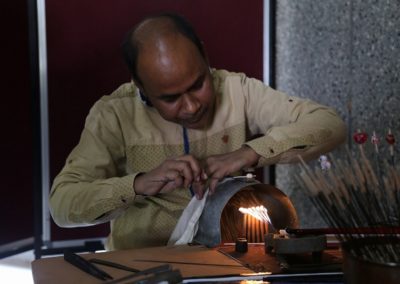 A glass beads artist from Varanasi giving a demo